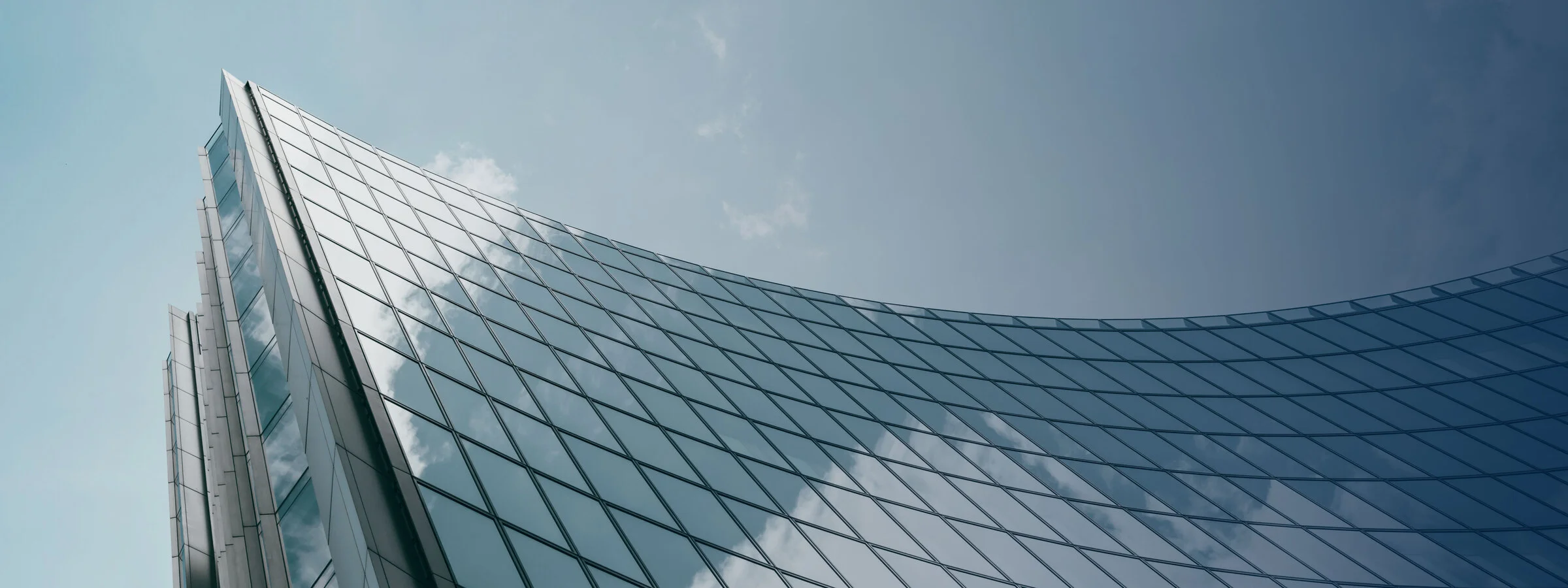 Building corner looking up at sky